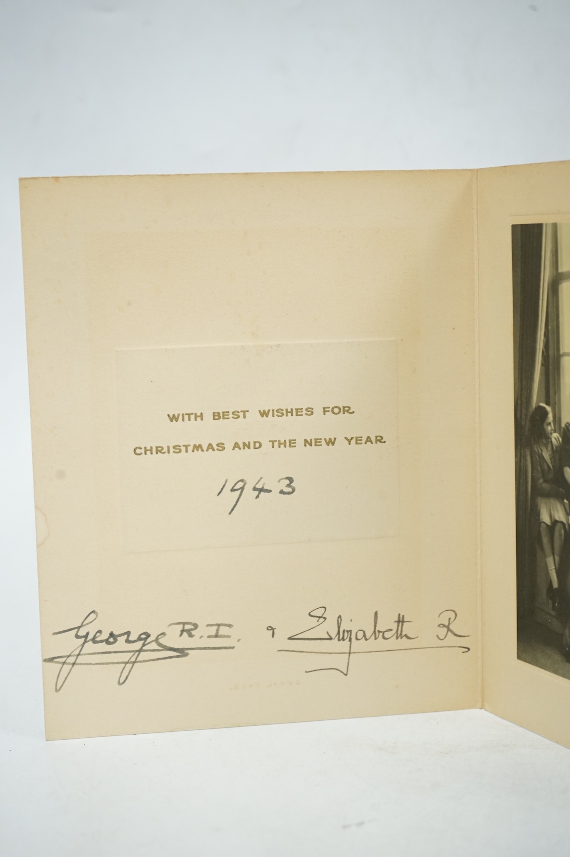 A Royal Christmas card from HM King George VI and Queen Elizabeth for 1943, published by Raphael Tuck and Sons Ltd. with a gilt embossed crown on the front, inside; ‘with best wishes for Christmas and the New Year 1943,